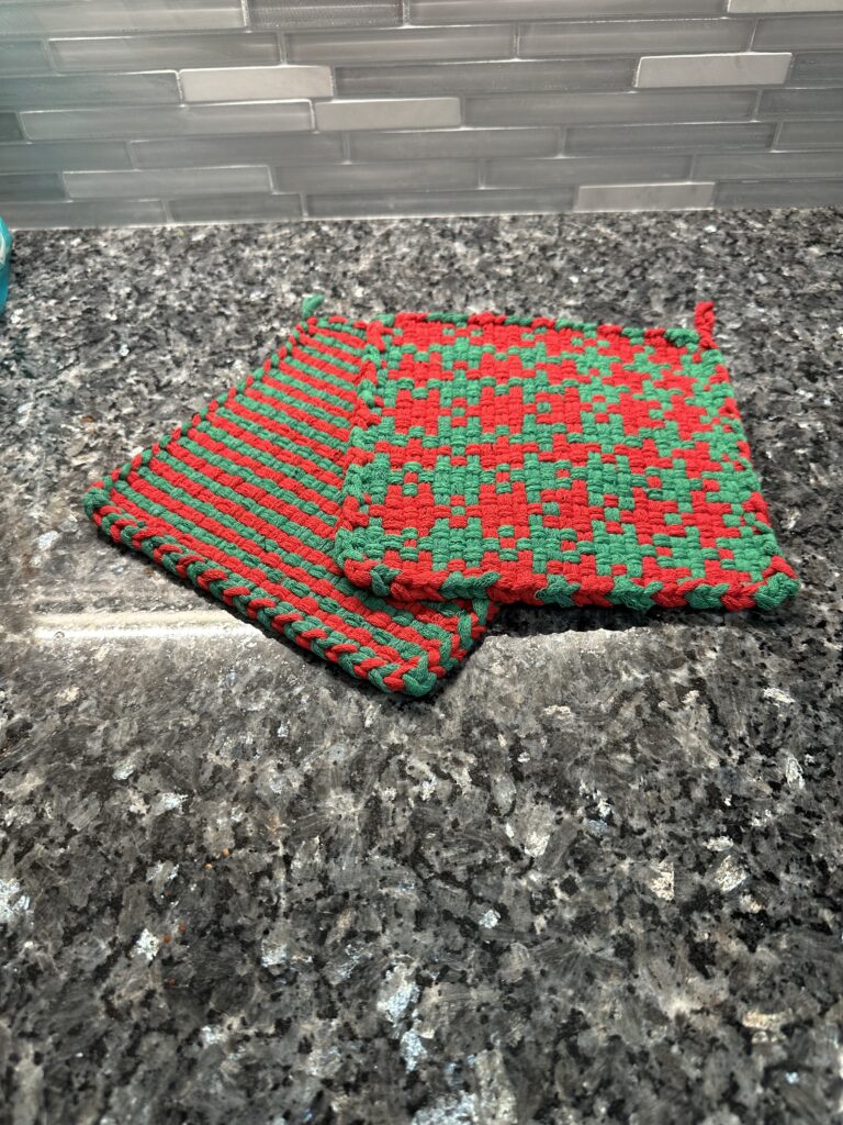Handwoven red and green Christmas potholders/trivets.